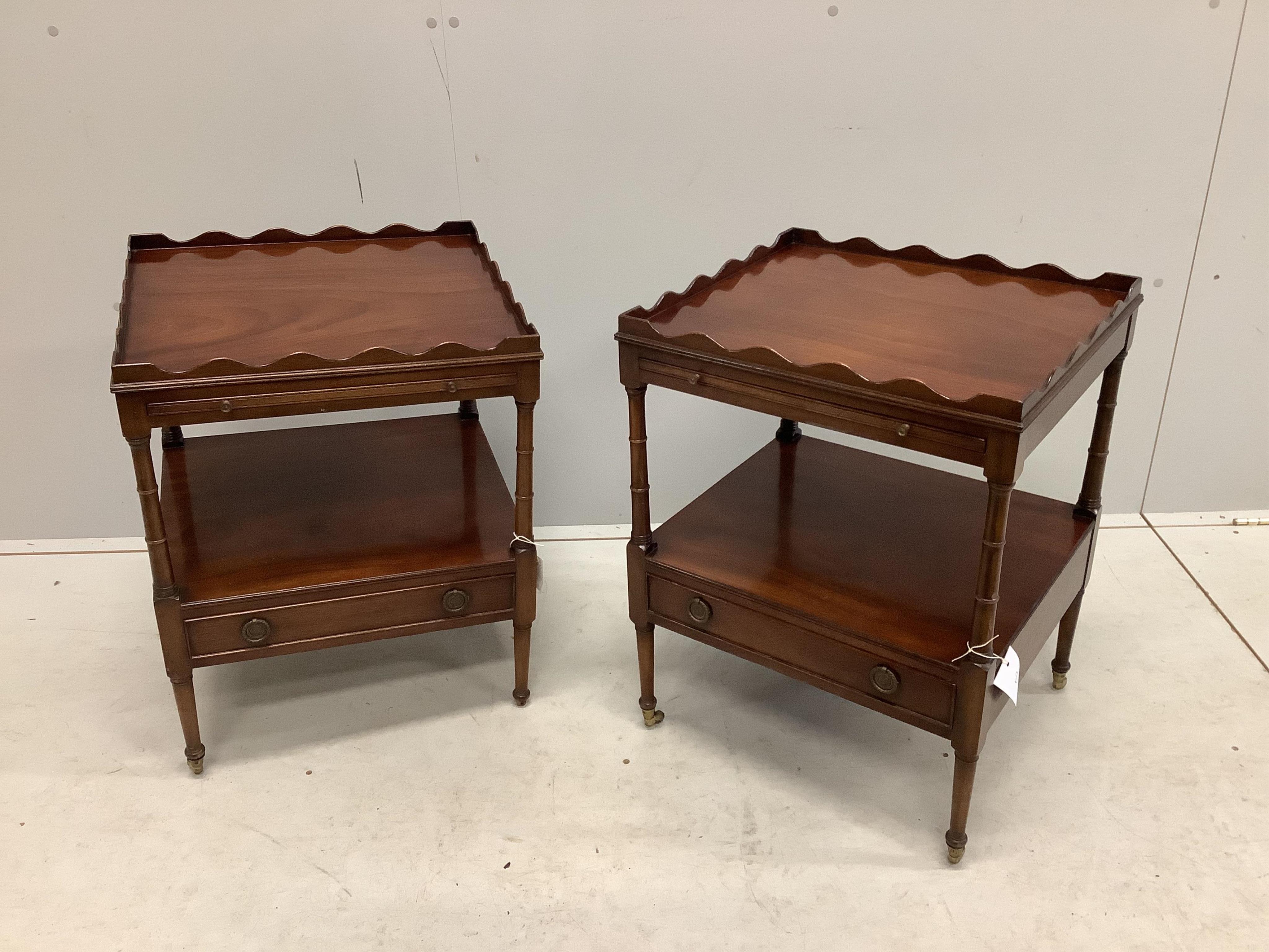 A pair of reproduction mahogany two tier tables fitted slides on ring turned legs, width 48cm, depth 44cm, height 63cm. Condition - fair but lacking one brass cup castor